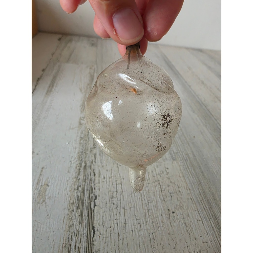Antique teardrop swirl silver glass ornament on silvered Xmas tree